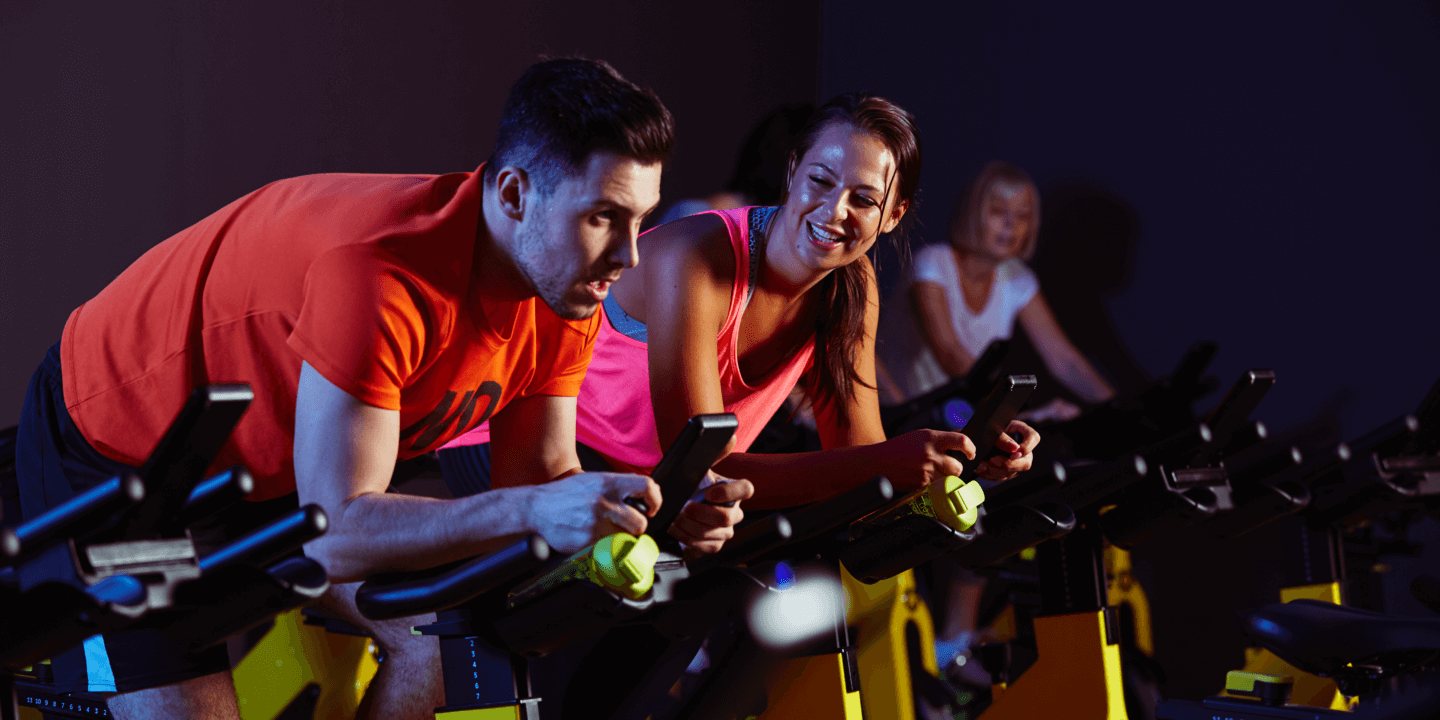 people on exercise bikes