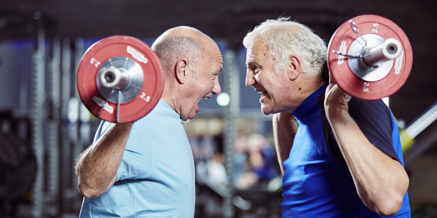 two men lifting weights