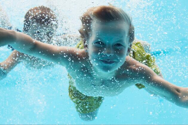 children swimming underwater