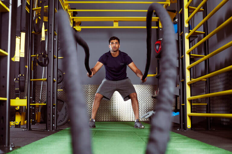 Man using battle ropes