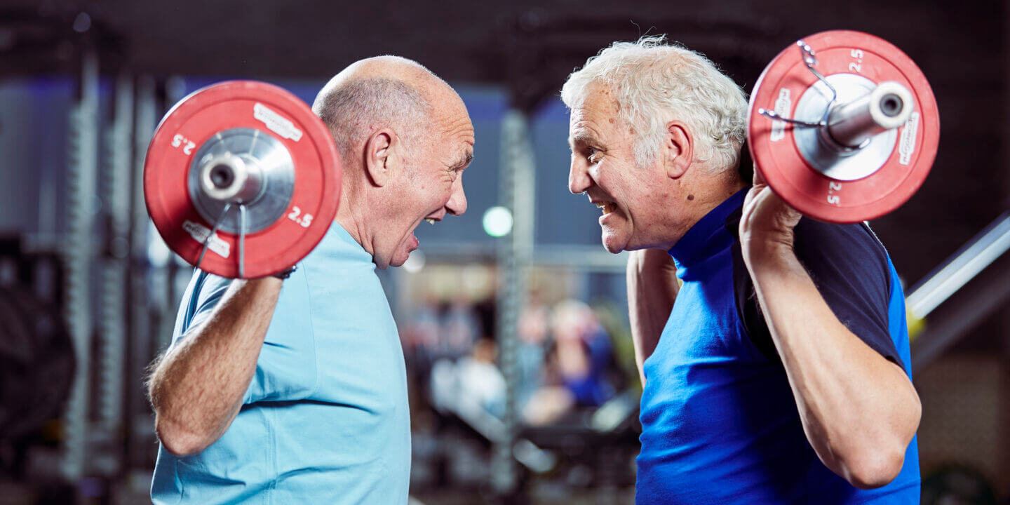 two men lifting weights