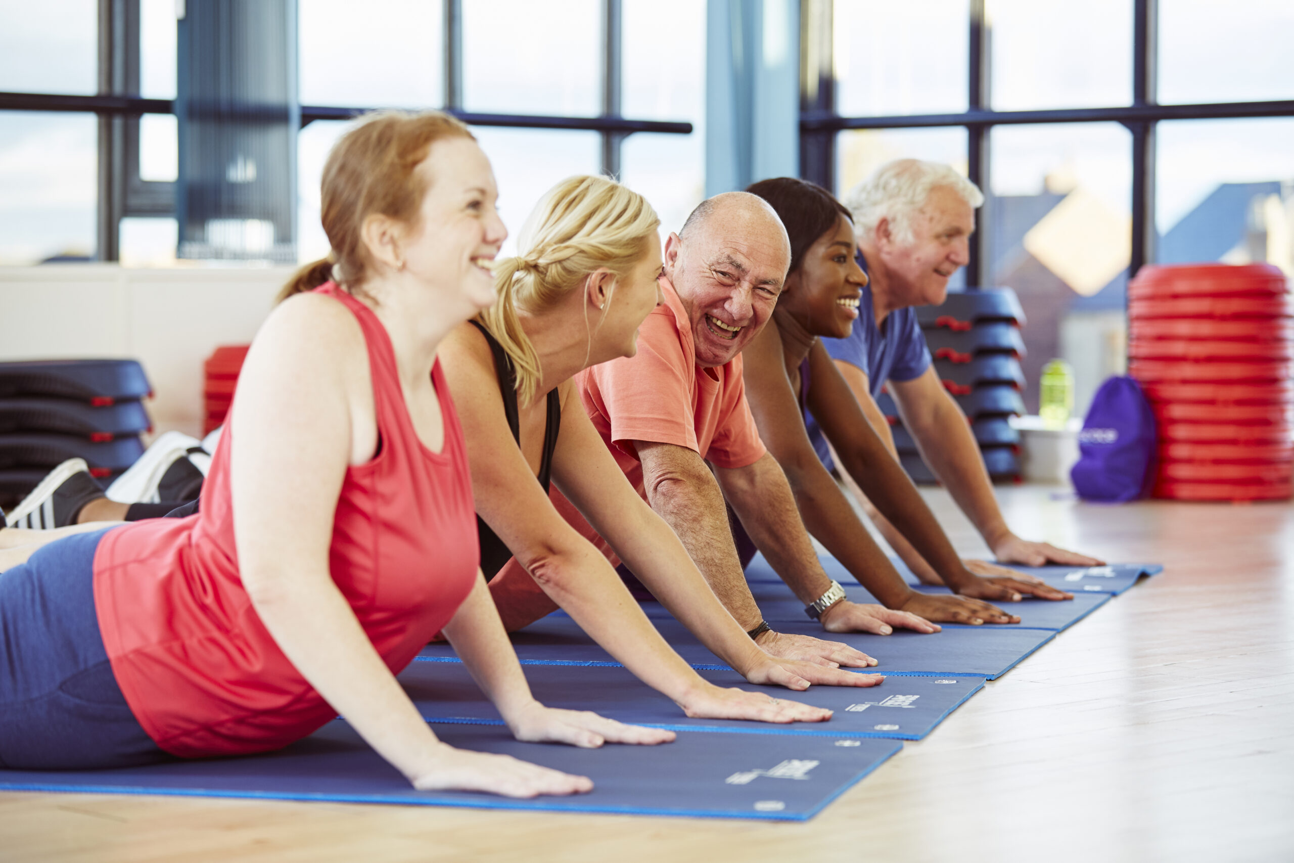 group of adults in a yoga class
