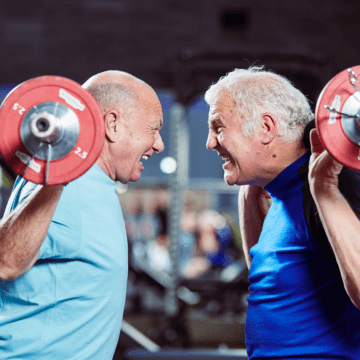 Photo of two men lifting weights