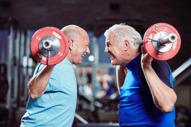 Photo of two men lifting weights