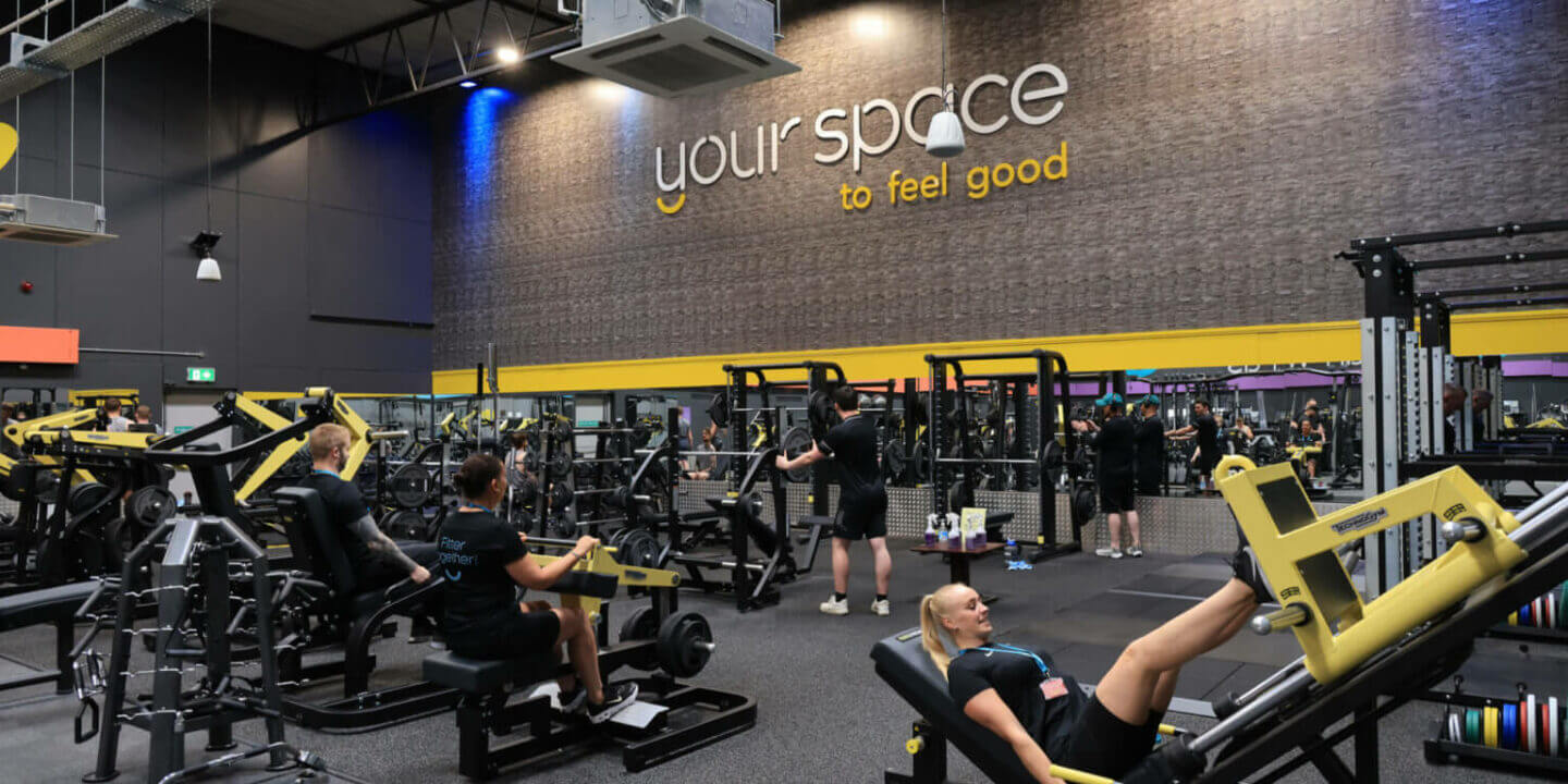 A group of people exercising in a gymnasium