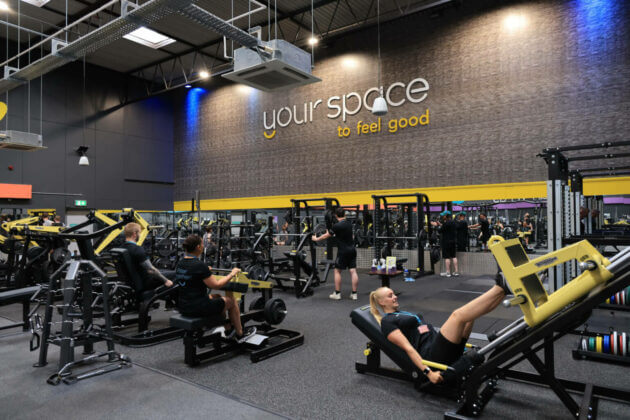 A group of people exercising in a gymnasium