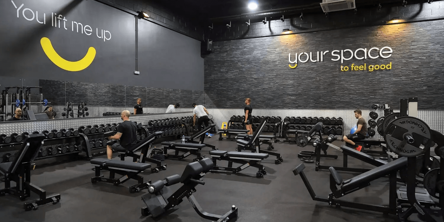 Photo of a group of people exercising in a gymnasium