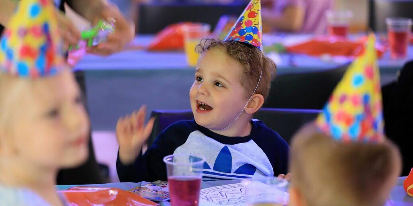 children wearing party hats