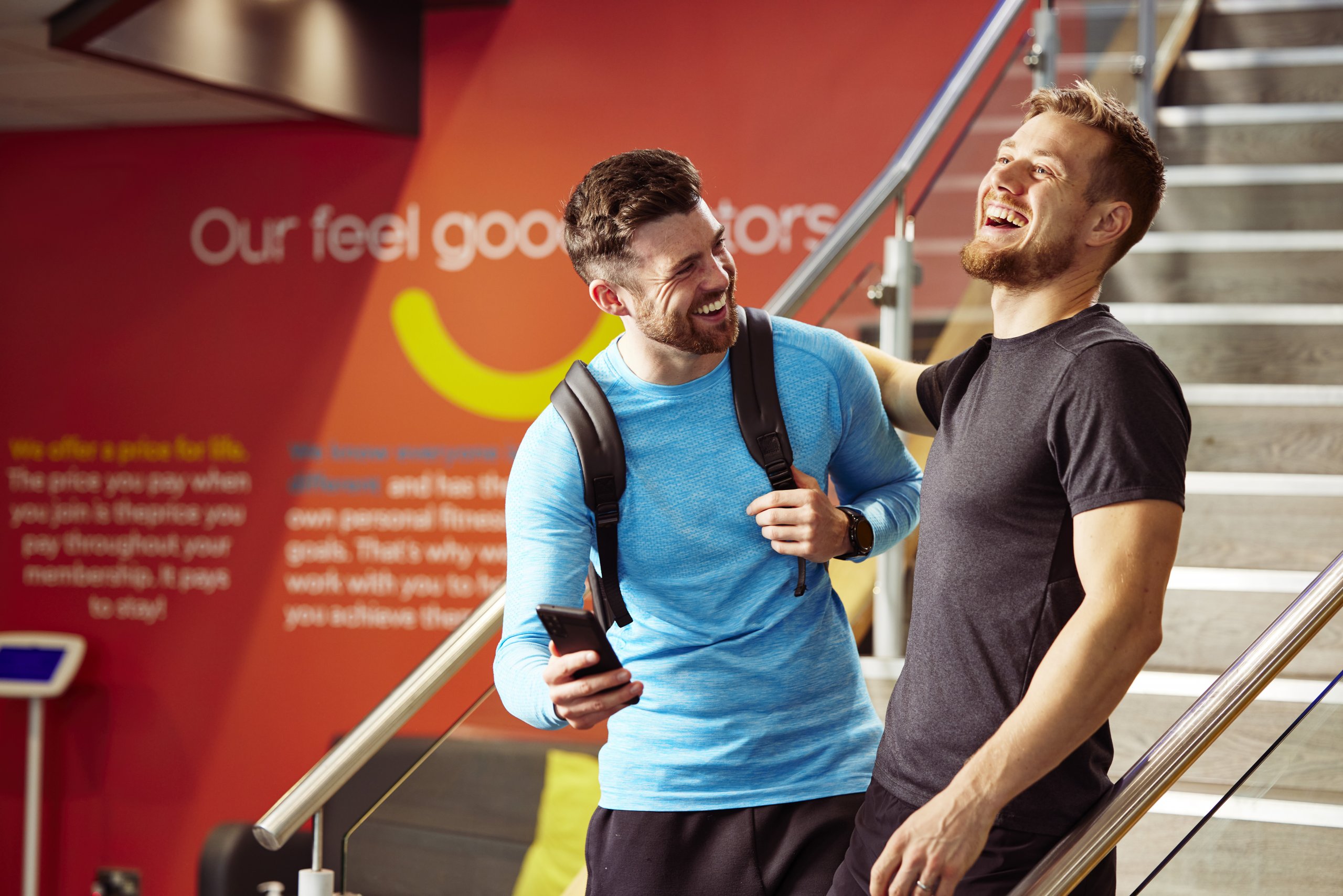 people on stairs of gym, laughing