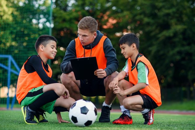 Football coach with Kids