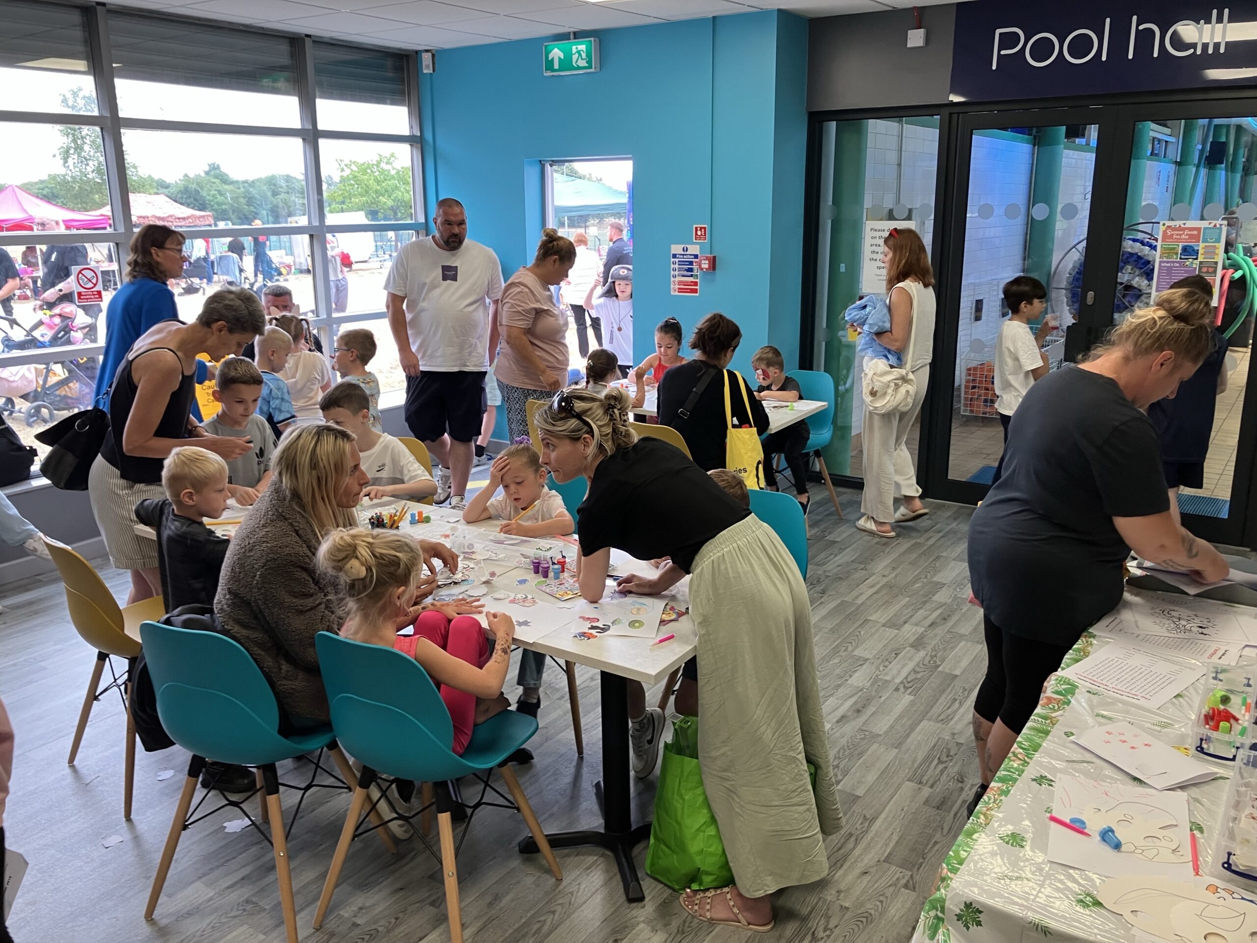 Children and families taking part in arts and crafts inside Your Space Dearneside